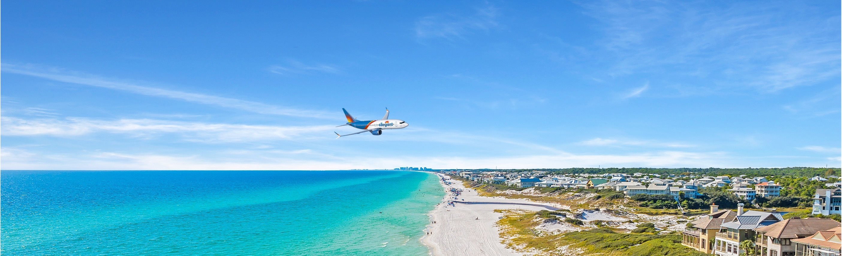 An airplane flying over coastal water 